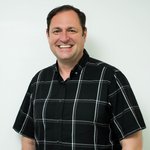 Kenny Pyatt headshot in black button-up shirt