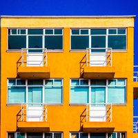Yellow Apartment building on a blue sky